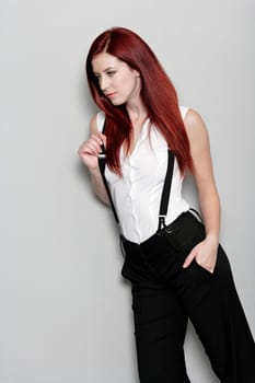 Beautiful young woman in smart business clothes in fashion style pose