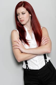 Beautiful young woman in smart business clothes in fashion style pose