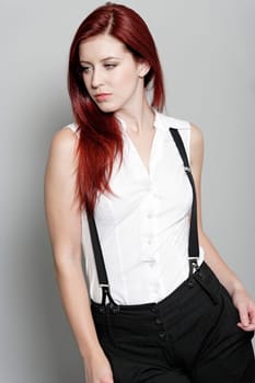 Beautiful young woman in smart business clothes in fashion style pose