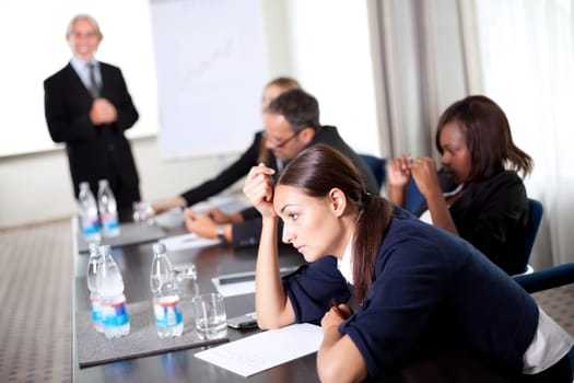 Young businessman discussing work with his colleagues at a meeting room