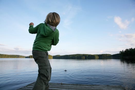Boy throws stones