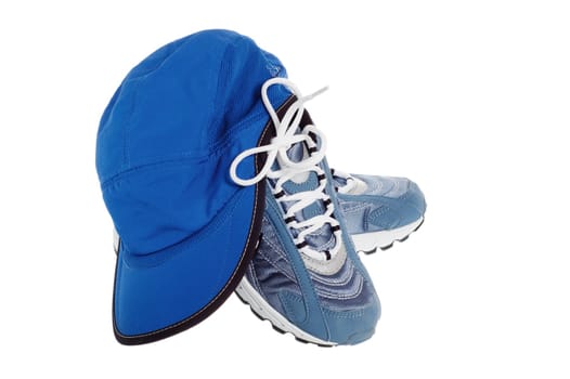 sports shoes and Cap isolated on white