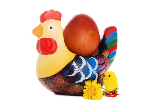 The wooden hen about an egg, it is isolated on white