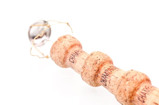 Three Champagne corks close up on white