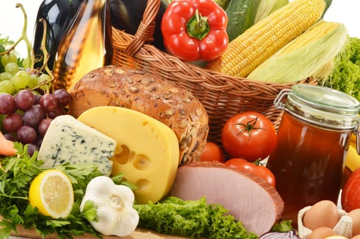 Composition with groceries in wicker basket on kitchen table