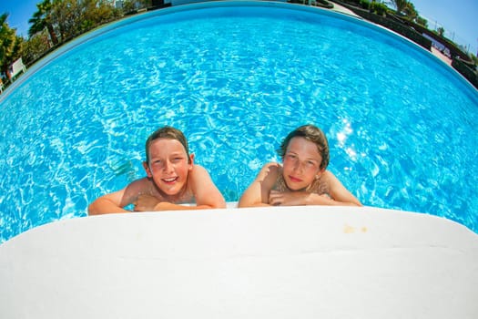 cute boy swimming in the pool