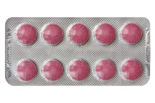 Red pills in blister, isolated on white background