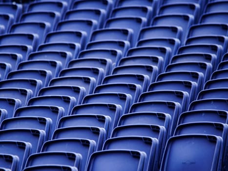 Empty plastic seats in a tribune