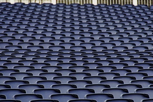 Empty plastic seats in a tribune