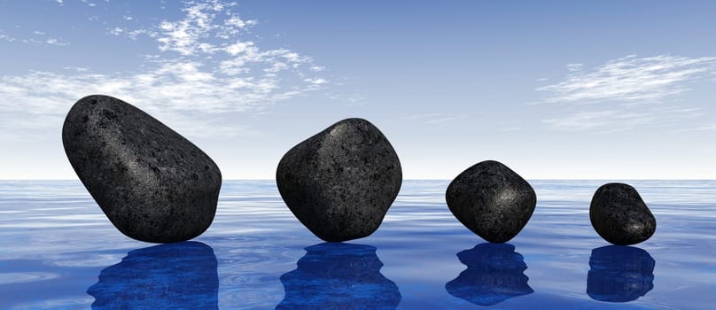 Black stones on blue water
