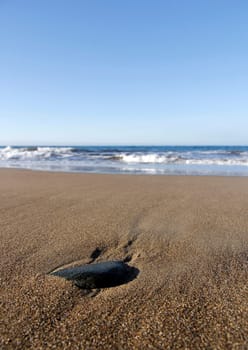 The Black Stone on the Beach