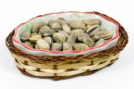 A heap of savory pistachio isolated on white background