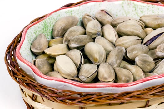 A heap of savory pistachio isolated on white background