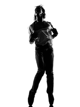 full length silhouette of a young man dancer dancing funky hip hop r&b on  isolated  studio white background