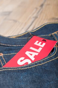 Red Sale Tag in Pocket of Blue Jeans