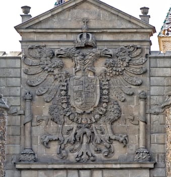 Detail coat of Toledo, on the walls of the city, crowning the gate hinge.