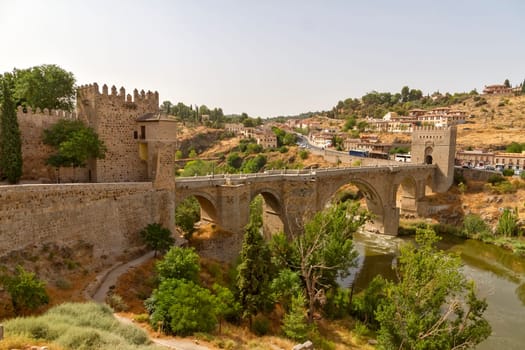City of Toledo near the bridge Puente de Alcantara over River Tajo, Spain