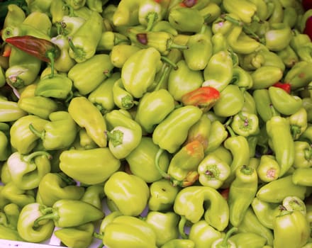 Green peppers in a market display as a pattern