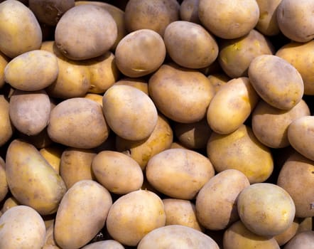 Brown potatoes pattern in a market display in mediterranean