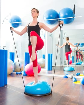 Bosu ball for fitness instructor woman in aerobics gym