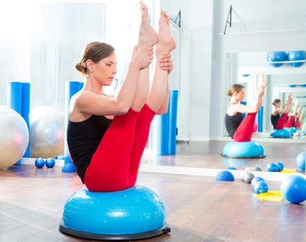 Bosu ball for fitness instructor woman in aerobics gym