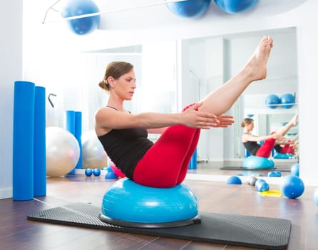Bosu ball for fitness instructor woman in aerobics gym