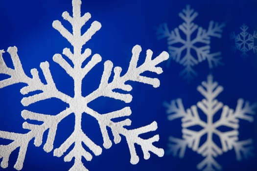 Blue background with snow flakes.