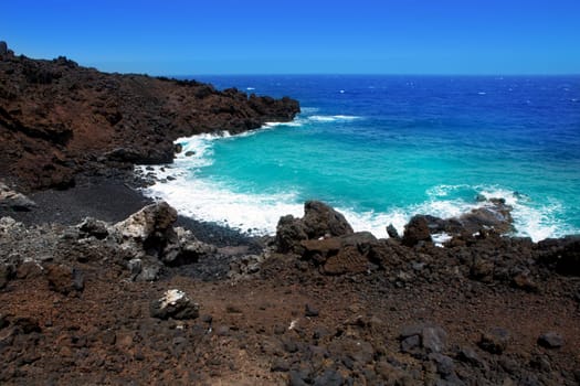 Atlantic volcanic black coast in la Palma with foam in funecaliente Canary Islands