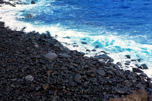 Atlantic volcanic black coast in la Palma with foam in funecaliente Canary Islands