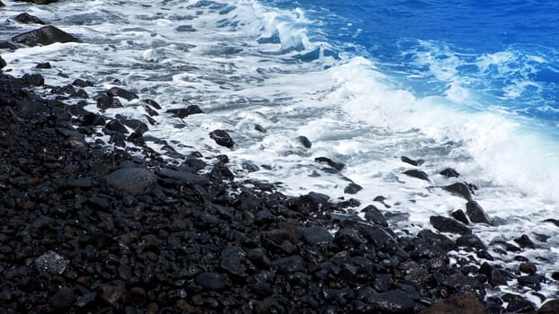 Atlantic volcanic black coast in la Palma with foam in funecaliente Canary Islands
