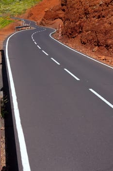 Canary Islands winding road curves in red mountain