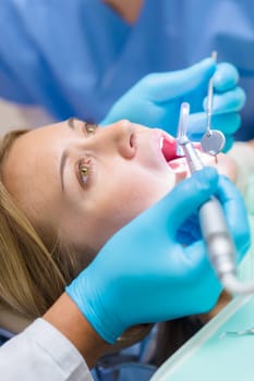 Close-up of dental treatment on female patient teeth checkup stomatology