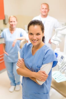 Portrait of young female dentist dental team at surgery office