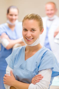 Portrait of dental team smiling female nurse with colleagues