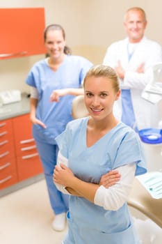 Portrait of dental team female dentist with colleagues