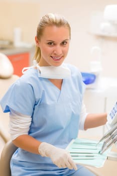 Professional dental staff with medical tools sitting at surgery office