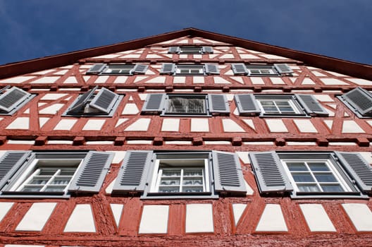 Half-timbered house from a frog's eye view with blue sky