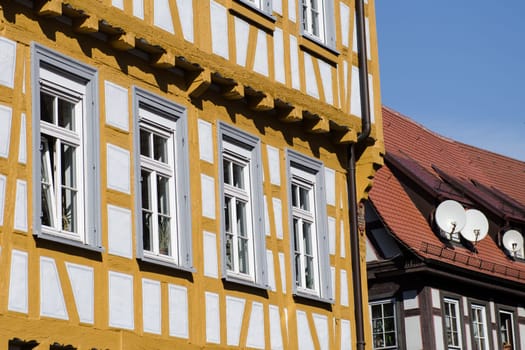 Old half-timbered house and three satellite dishes