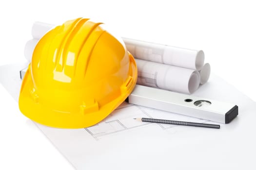 Image of  blueprints with level pencil and hard hat on table