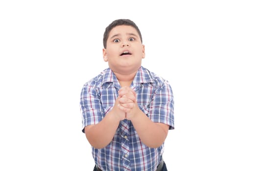 Shocked 10 year old boy trying to defend himself isolated on white