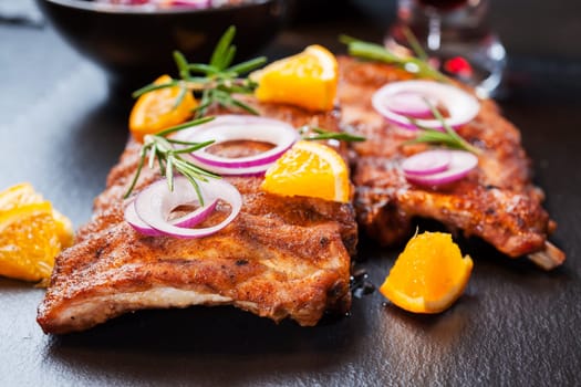 BBQ spare ribs marinated in orange sauce with herbs and wine