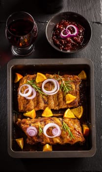 Delicious BBQ spare ribs with chutney and wine