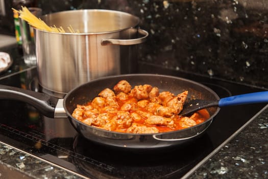 Cooking - meat balls in the pan with pasta