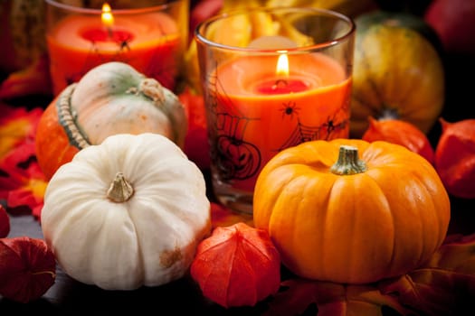 Happy Halloween - pumpkins and candles still life