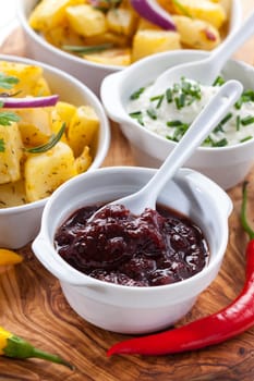 Chutney and sour cream with baked potatoes