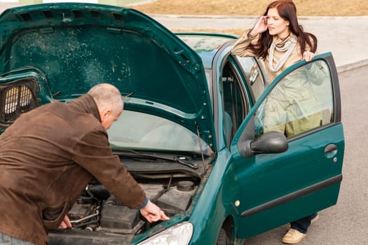 Car breakdown woman calling for road assistance man repair motor