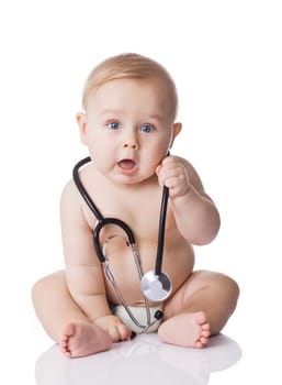 Sweet baby with stethoscope on a white background. Adorable baby boy on white