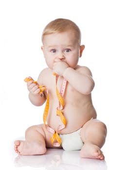 Adorable Baby Boy with a measuring tape.