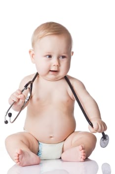 Sweet baby with stethoscope on a white background. Adorable baby boy on white