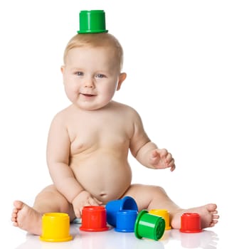 Baby playing with cup toys. Isolated on white background